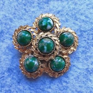 brooch with green stone
